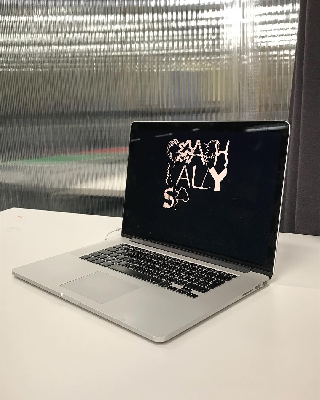 The Graphically Speaking logo displaying on a laptop